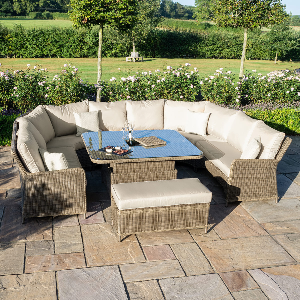 Natural coloured rattan u shaped sofa with matching bench and ice bucket rising table.