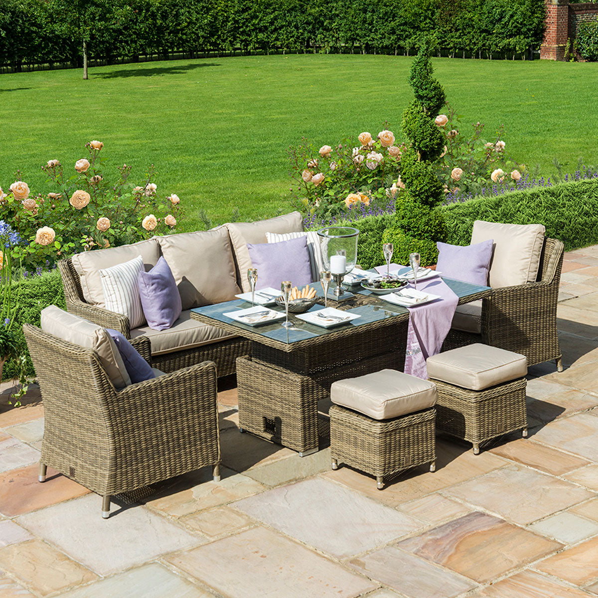 Brown coloured rattan 3 seat sofa dining set with two armchairs, two stools and a rectangle ice bucket rising table.