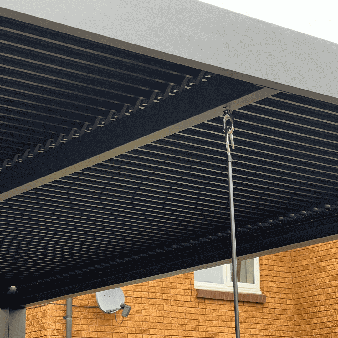 Close up of an aluminium pergola manual louvred roof and crank handle