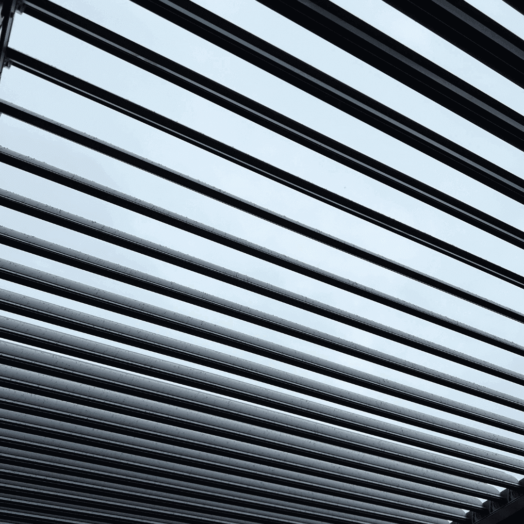 Close up of an aluminium pergola manual louvred roof with louvres open