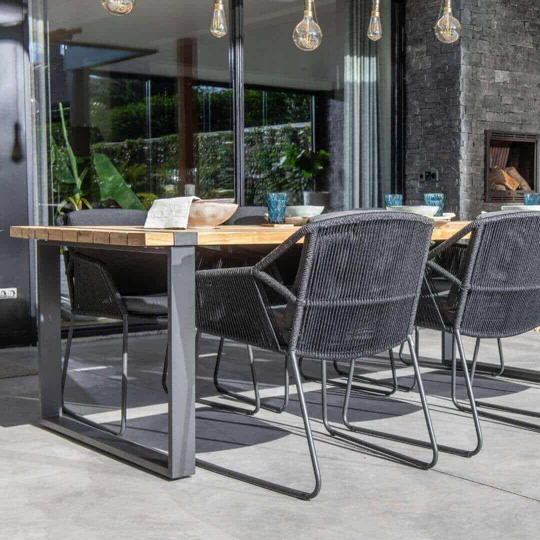 Close up of a 6 Seat Dining Set with Teak Table Top and Aluminium Legs. Rope Dining Chairs.
