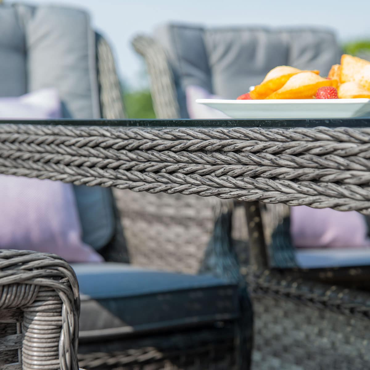 Close up of a grey rattan dining table