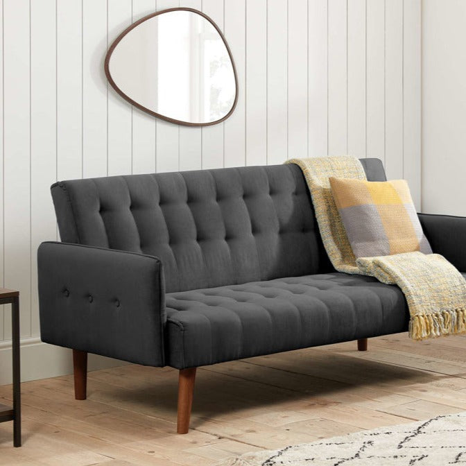 Charcoal fabric sofa bed with wooden legs.