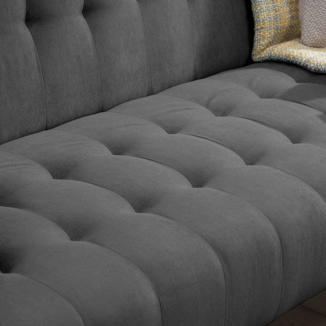 Close up of a charcoal fabric sofa bed.