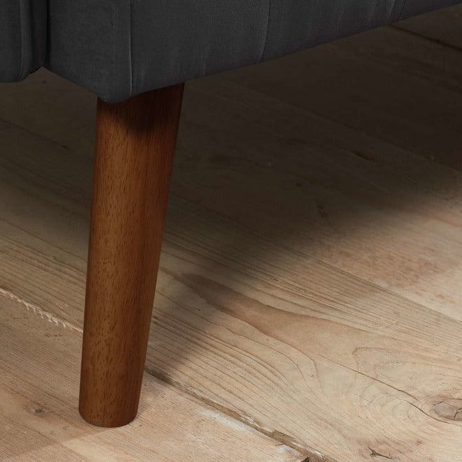 Close up of wooden sofa bed legs.