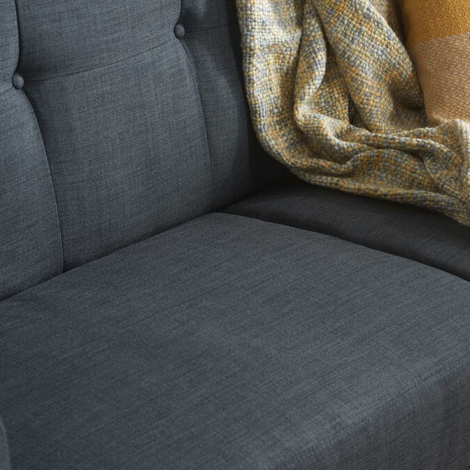Close up of a grey sofa bed seat
