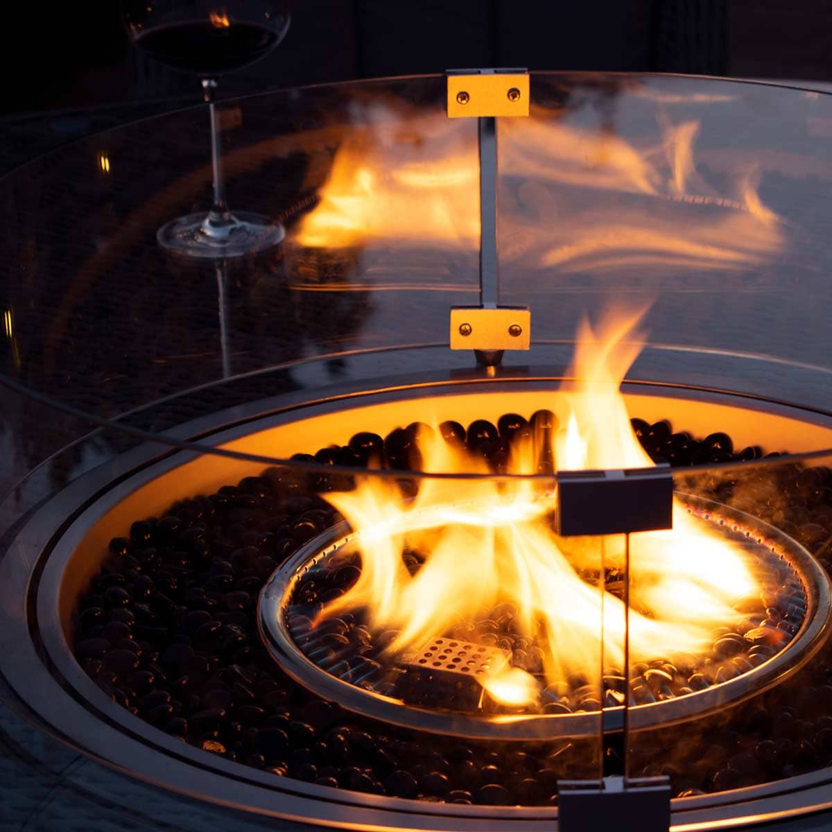 Close up of the fire pit and round glass surround