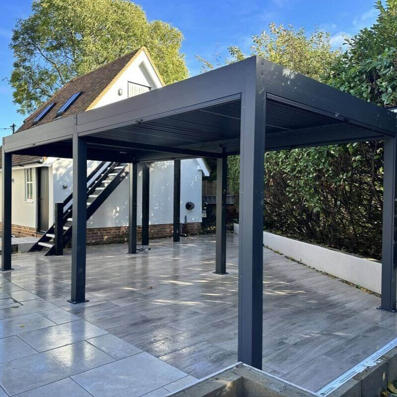 3m x 6m anthracite grey aluminium pergola with manual louvred roof, manual privacy screens and white LED lights