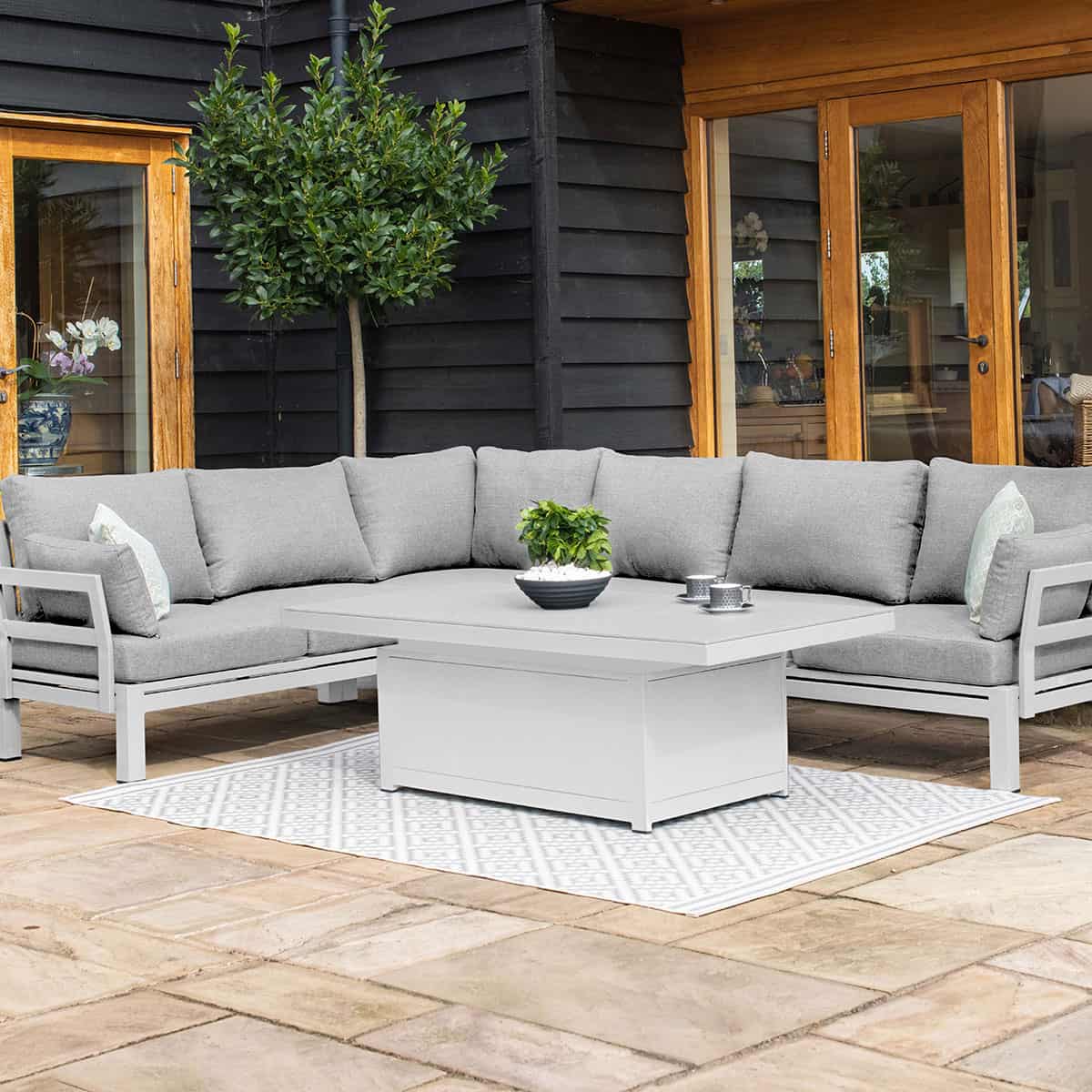 Aluminium corner sofa with rectangular rising table #colour_white