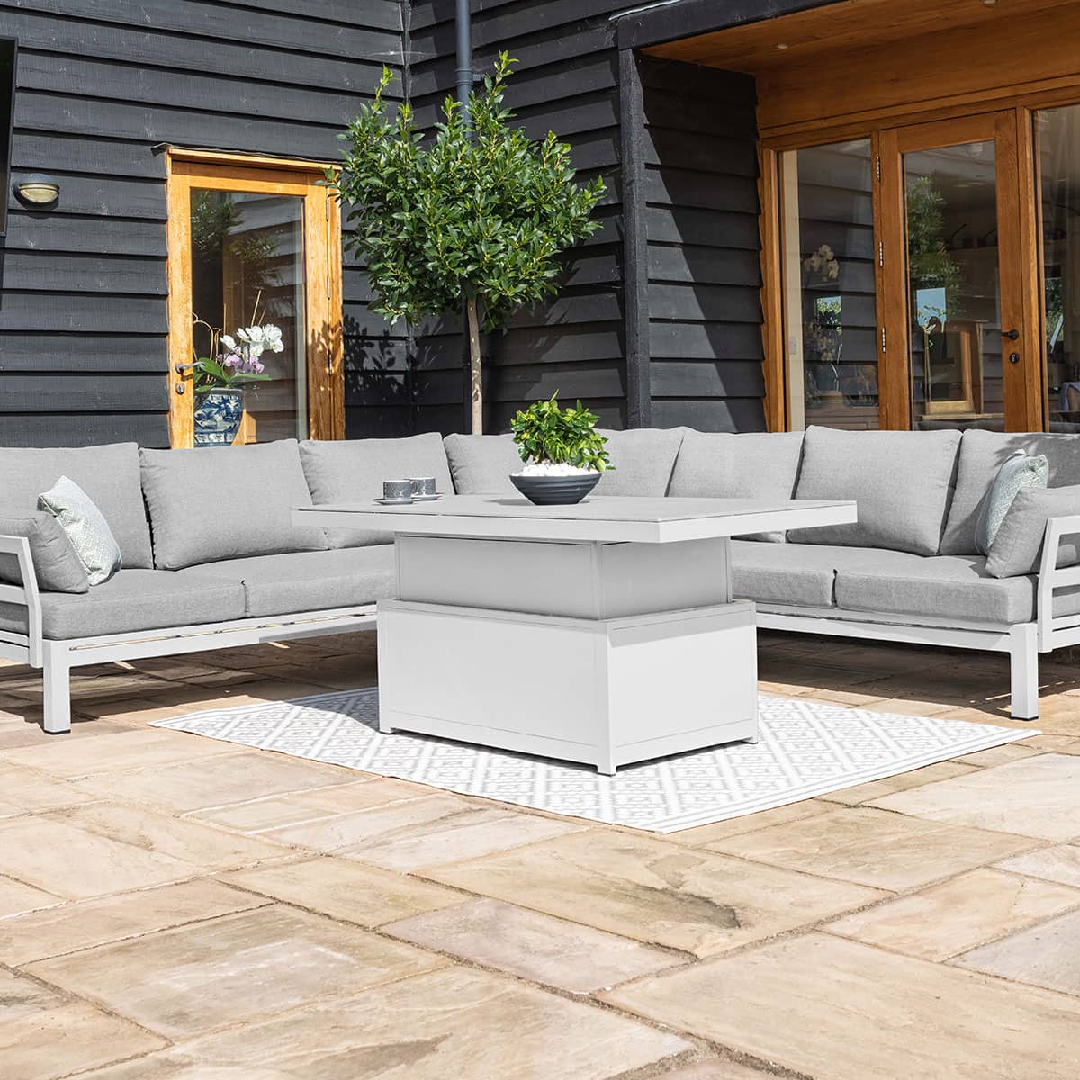 Aluminium large corner sofa with rectangular rising table #colour_white