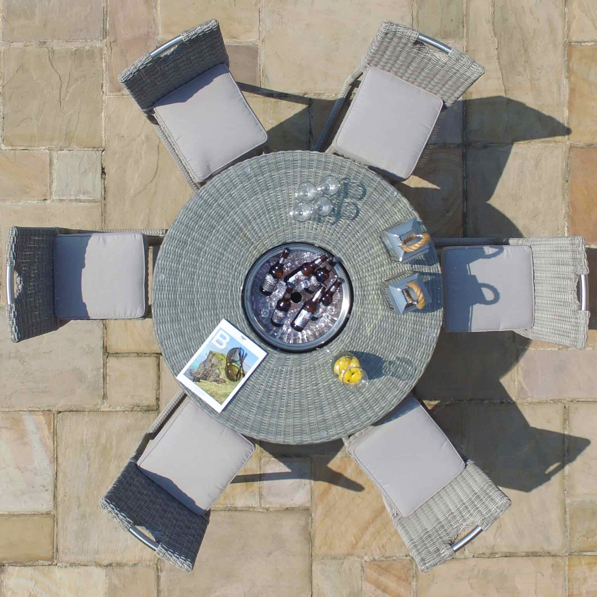 Overhead view of a light grey rattan 6 seat round bar set with ice bucket table