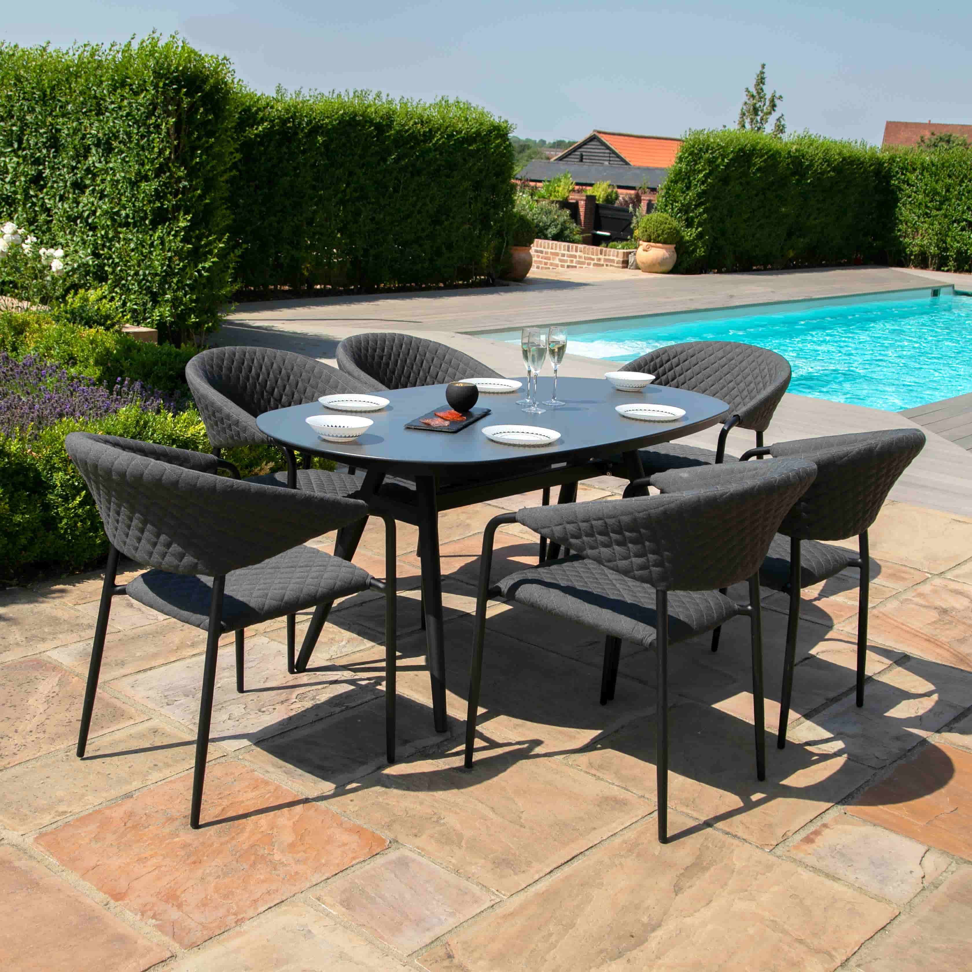 Fabric 6 seat oval dining set with quilted chairs #colour_charcoal