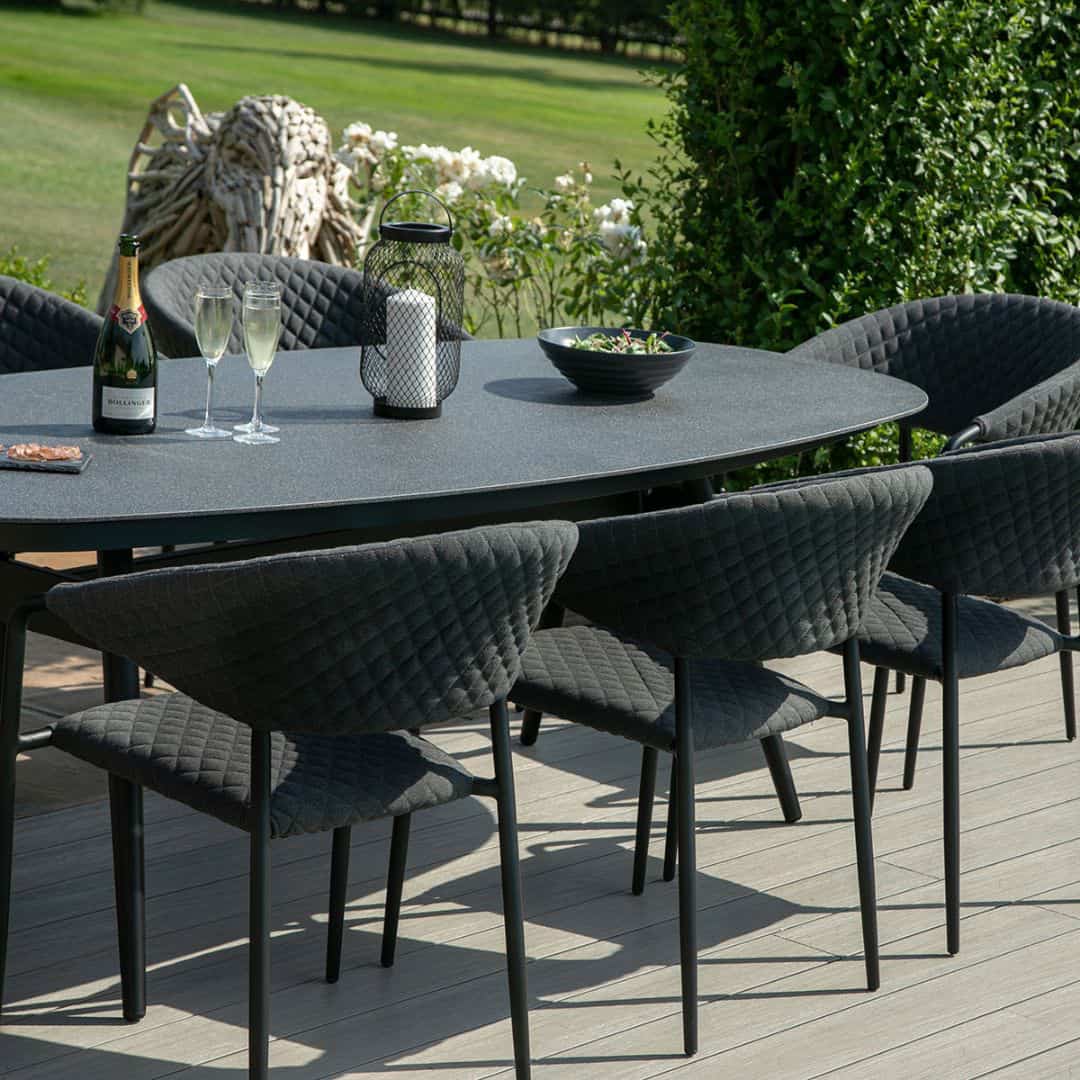 Fabric 8 seat oval dining set with quilted chairs #colour_charcoal