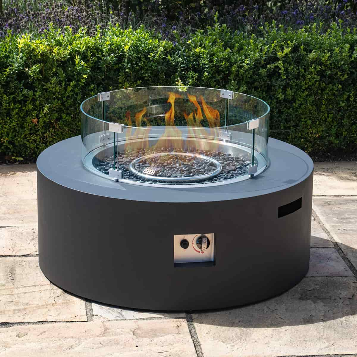 Black round store gas fire pit