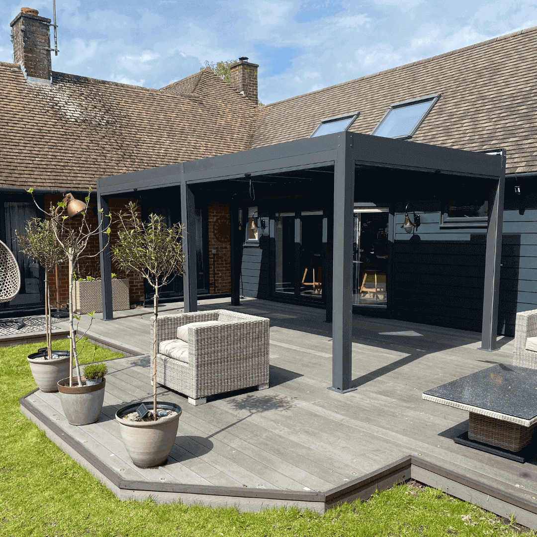 3m x 6m anthracite aluminium pergola with motorised louvred roof, motorised privacy screens and white LED lights
