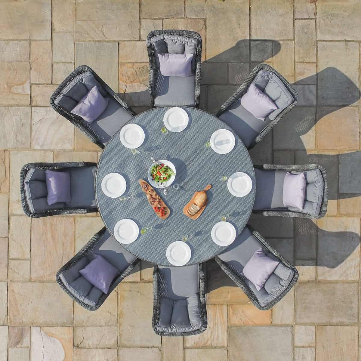 Overhead view of a grey rattan 8 seat round dining set with high back chairs