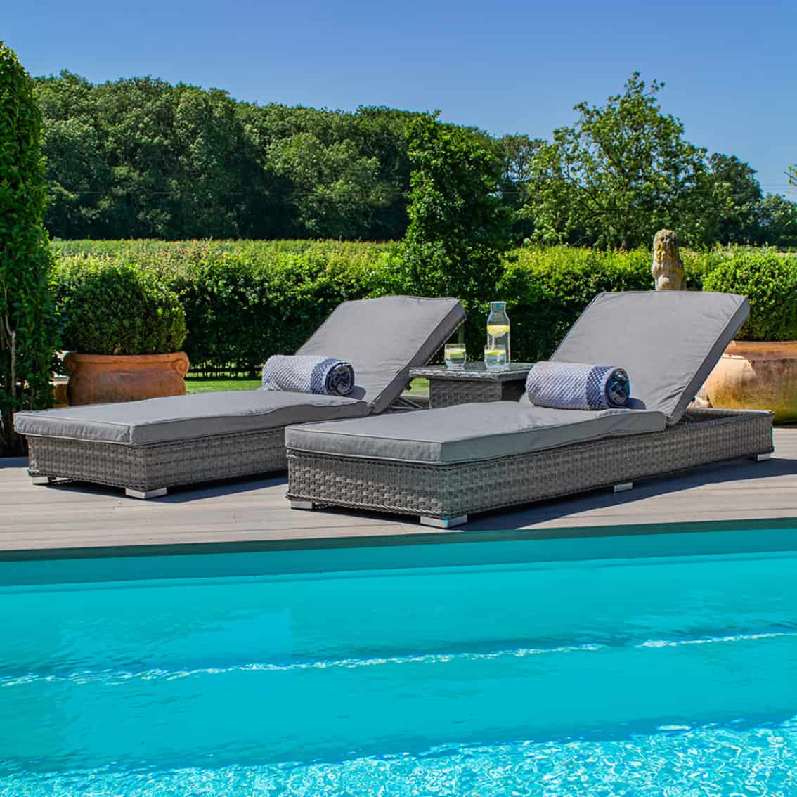 Grey rattan double sunlounger set with side table