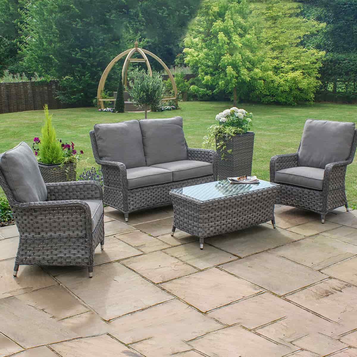 Grey rattan high back 2 seat sofa set with two chairs and a matching coffee table