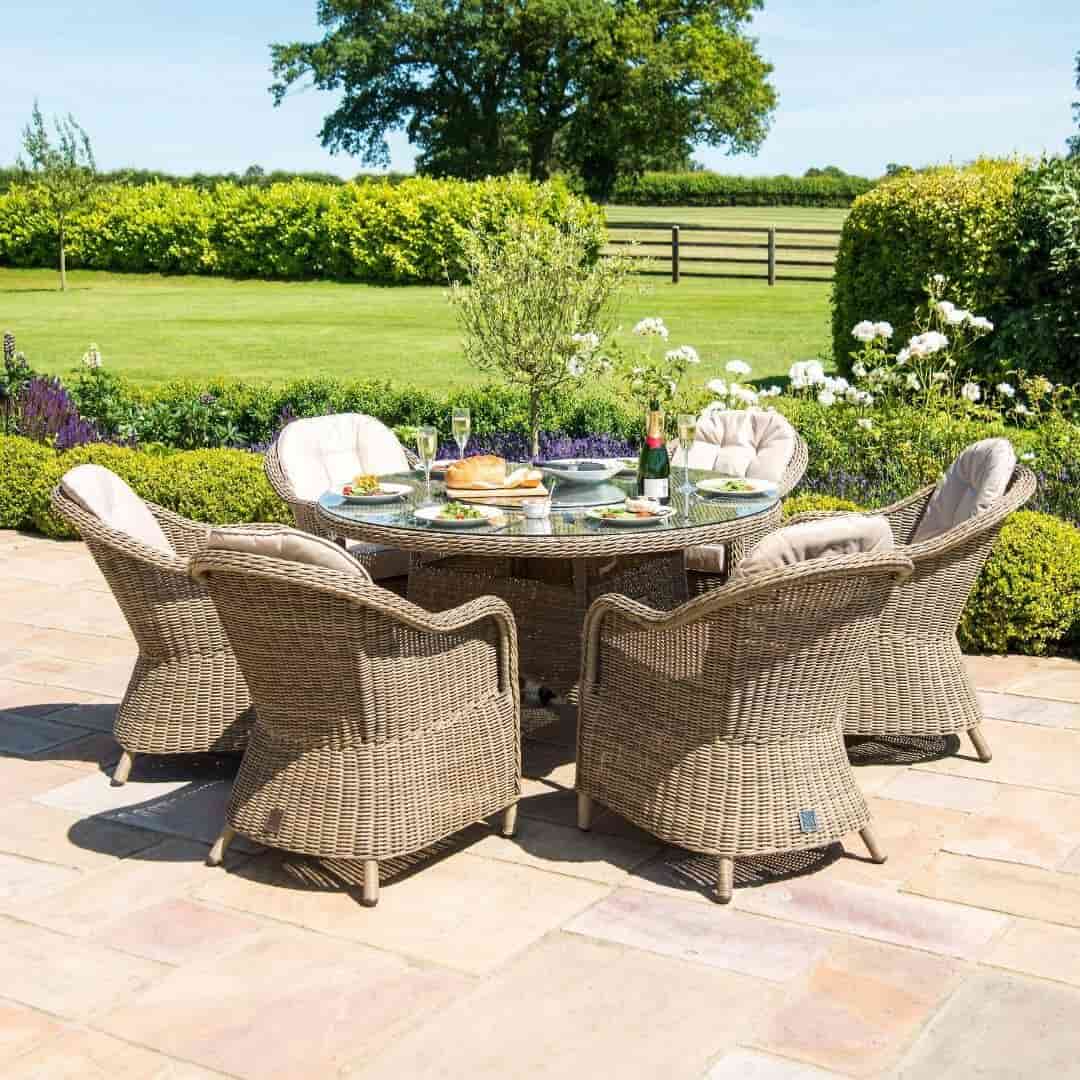 Natural coloured rattan 6 seat round fire pit dining set with heritage chairs and lazy susan