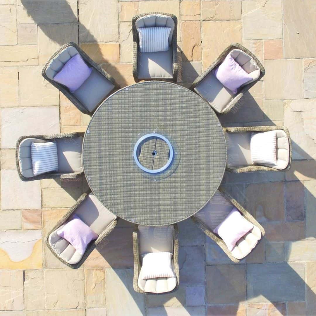 Overhead view of natural coloured rattan 8 seat round dining set with ice bucket and lazy suzan