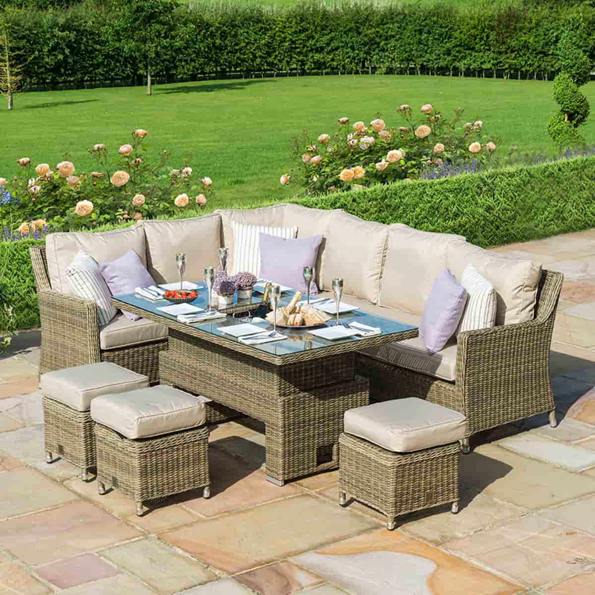 Natural coloured rattan corner dining set with three stools and rising table with ice bucket centrepiece