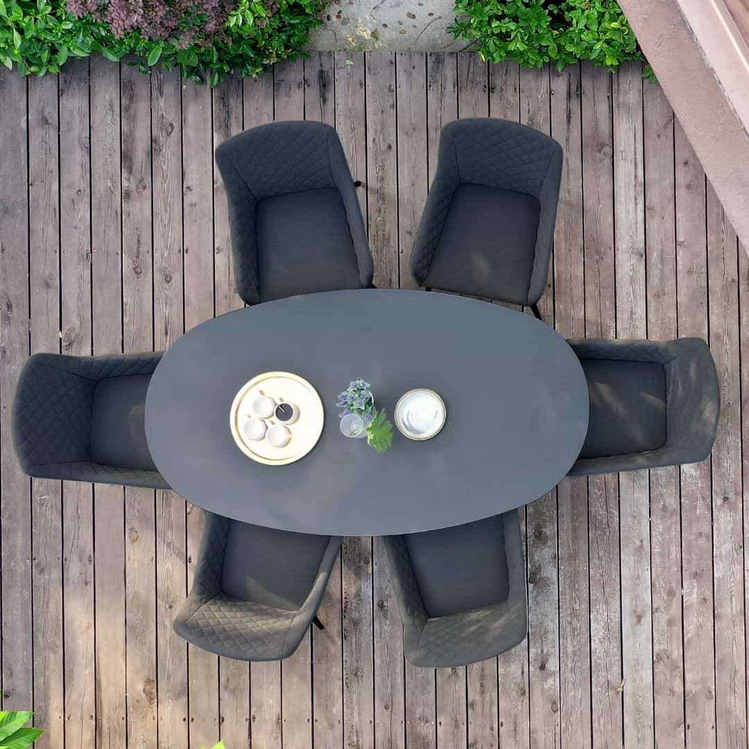 Overhead view of a 6 seat oval dining set with charcoal fabric dining chairs #colour_charcoal