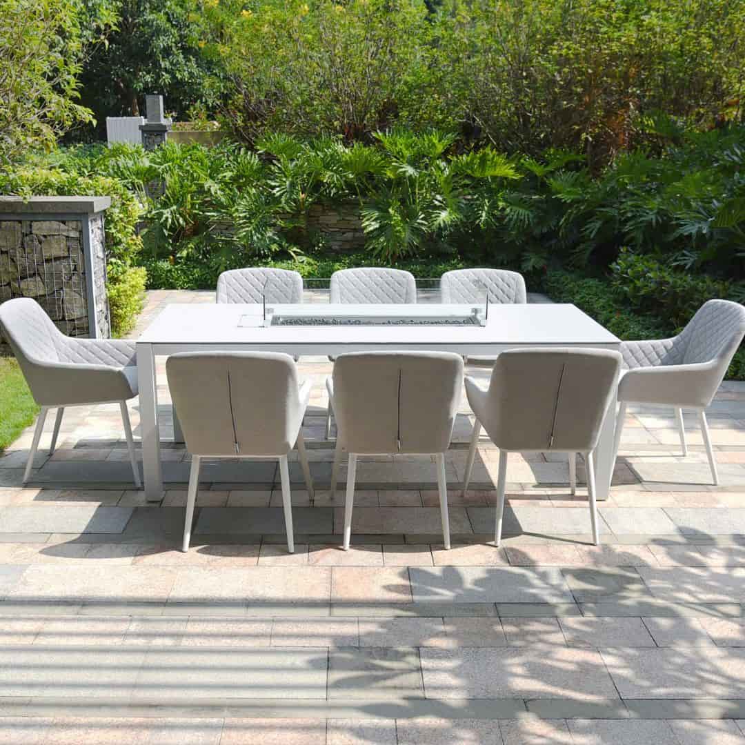 Side view of a white frame and light grey fabric chairs. 8 seat rectangular fire pit dining set #colour_lead chine