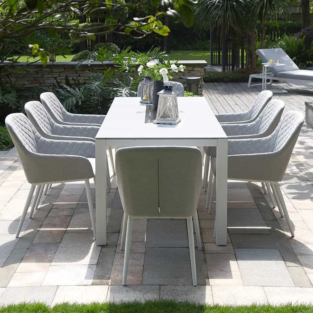 Front view of a white frame and light grey fabric chairs. 8 seat rectangular fire pit dining set #colour_lead chine