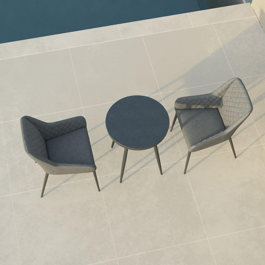 Overhead view of a 2 seat bistro set with round table and grey fabric chairs #colour_flanelle