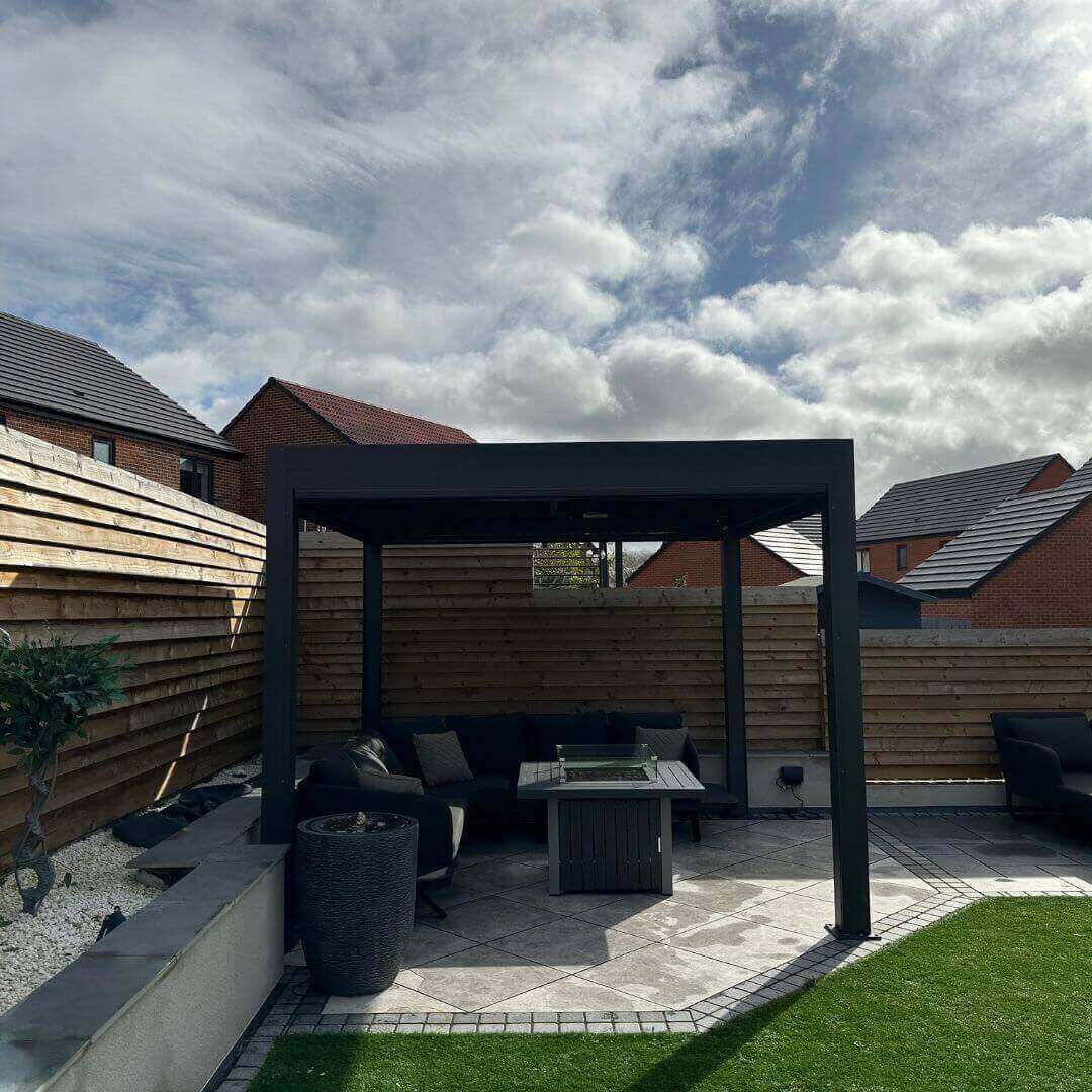 3m x 6m anthracite grey aluminium pergola with motorised louvred roof, motorised privacy screens and white LED lights