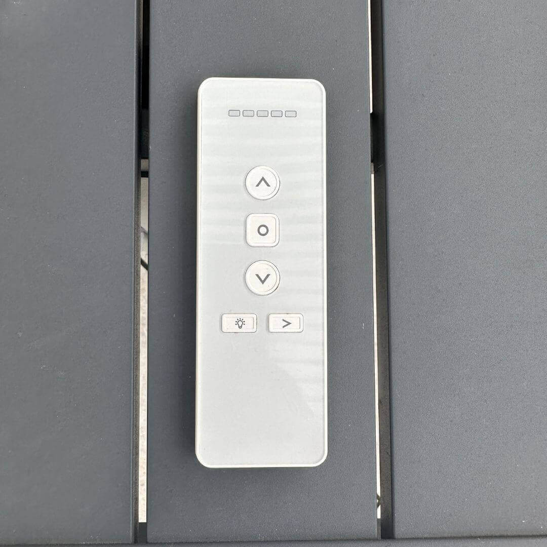 Close up of the remote control for the fully motorised aluminium pergola