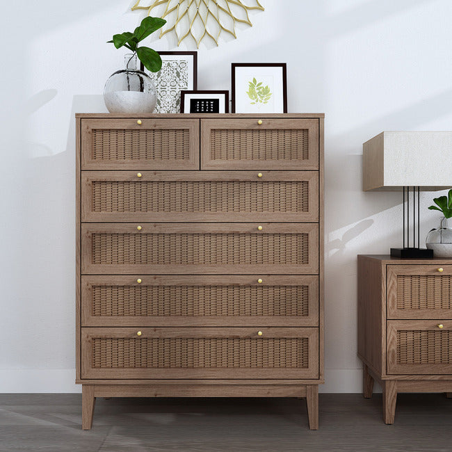 Oak coloured 6 drawer chest with rattan fronts and gold handles. Four equal sized drawers and two smaller drawers.