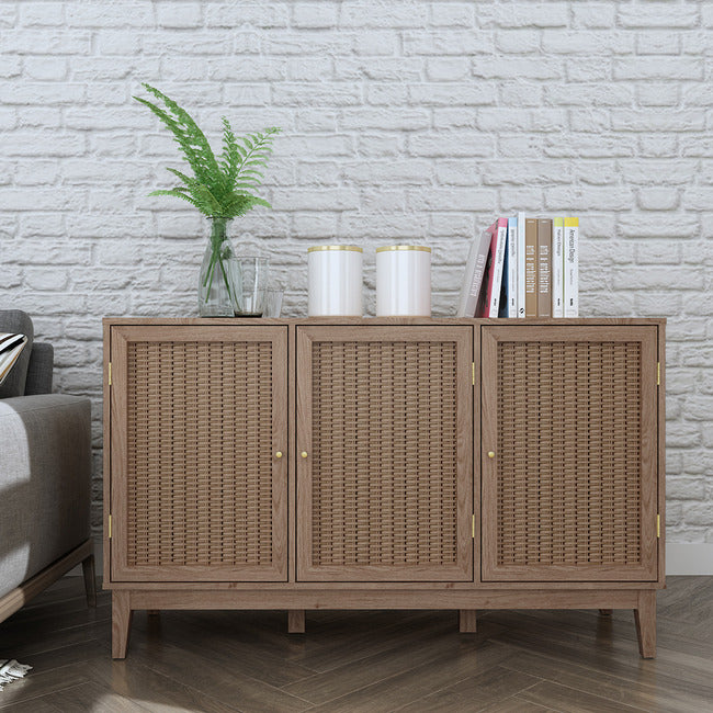 Oak coloured 3 door sideboard with rattan fronts and gold handles.