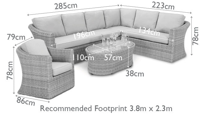 Light grey coloured rattan corner sofa with oval coffee table.