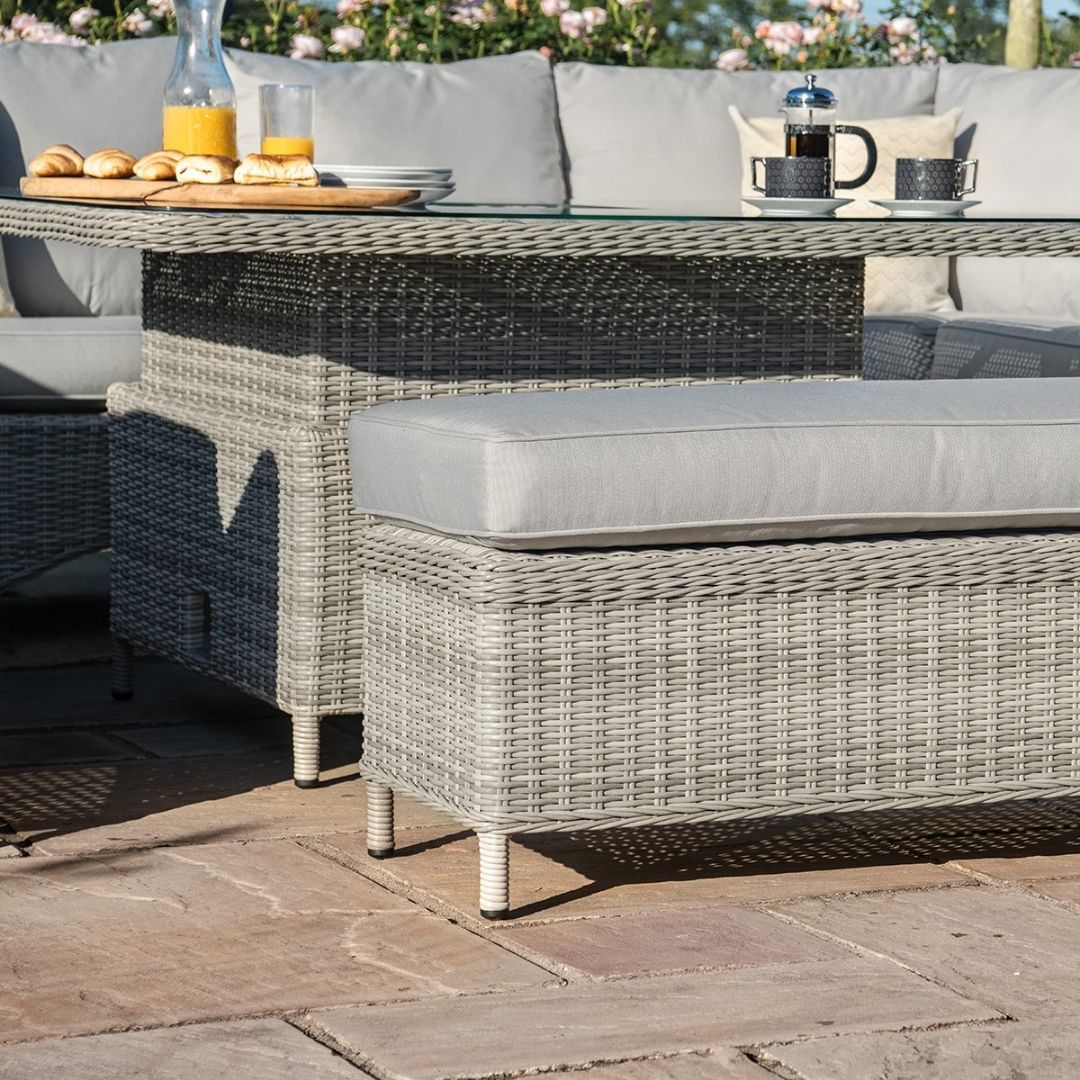 Light grey coloured rattan u shape sofa with matching bench and square rising table.