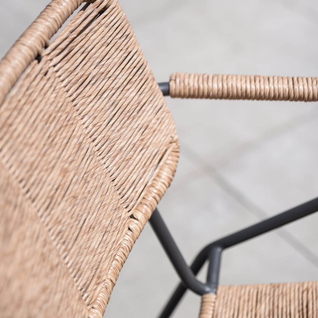 Close up of a wicker dining chair. 