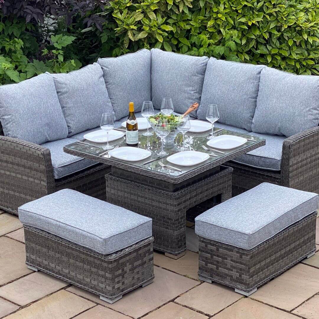 Dark grey rattan casual corner sofa dining set with corner sofa, two benches and a square rising dining table with tempered glass table top.