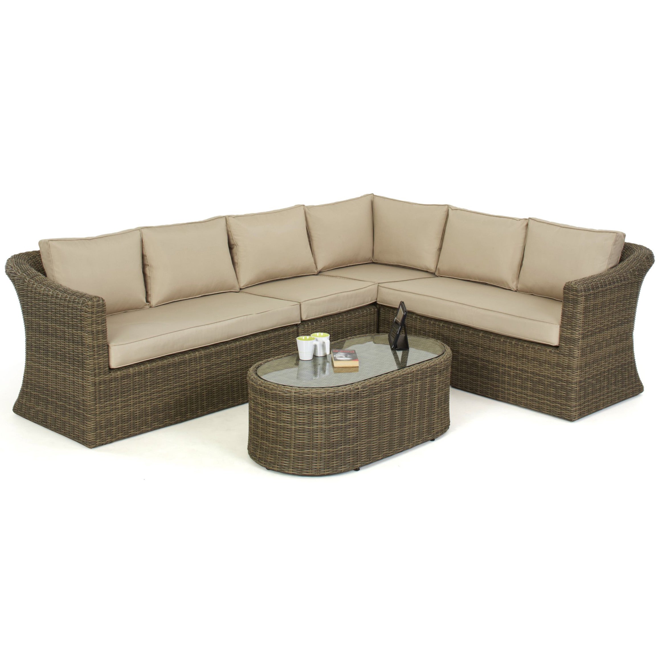 Natural coloured rattan corner sofa with oval coffee table.