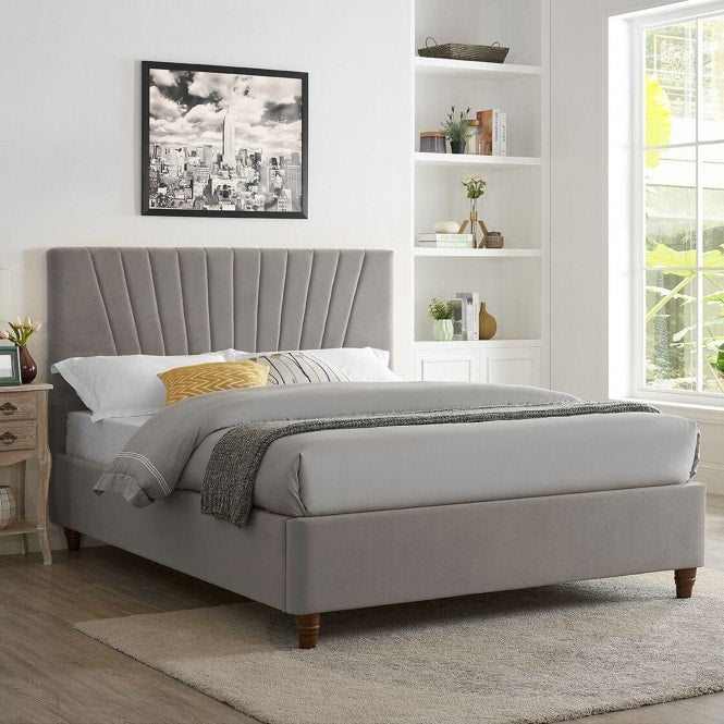 Grey velvet bed frame with stitched detail headboard.