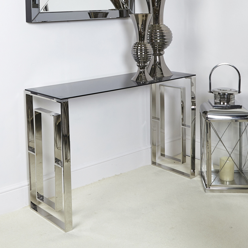 Steel chrome effect console table with geometric table ends and tempered smoked glass table top.